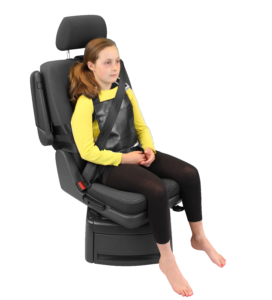 Houdini 13 harness being modeled by a young girl, providing secure postural support in vehicles.