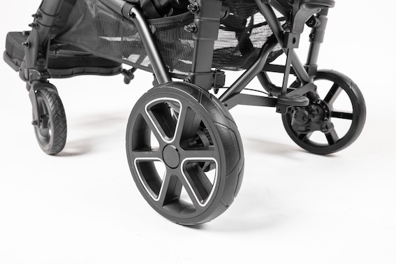 Close up image of back wheels on a stroller.