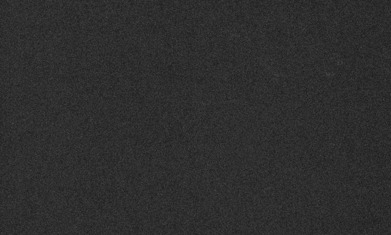 Close up on dark grey custom Spex knitted fabric, designed for breathability and machine washing.