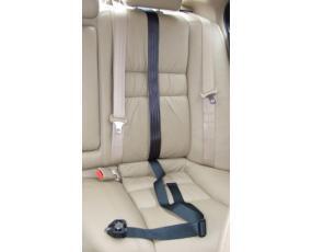 Black extra fixing strap on cream seat in car.