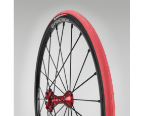 Close up view of a red tire on a grey background.