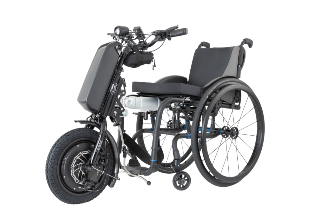The Klaxon Klick Race is a compact handbike add-on, designed to boost wheelchair speed and performance.