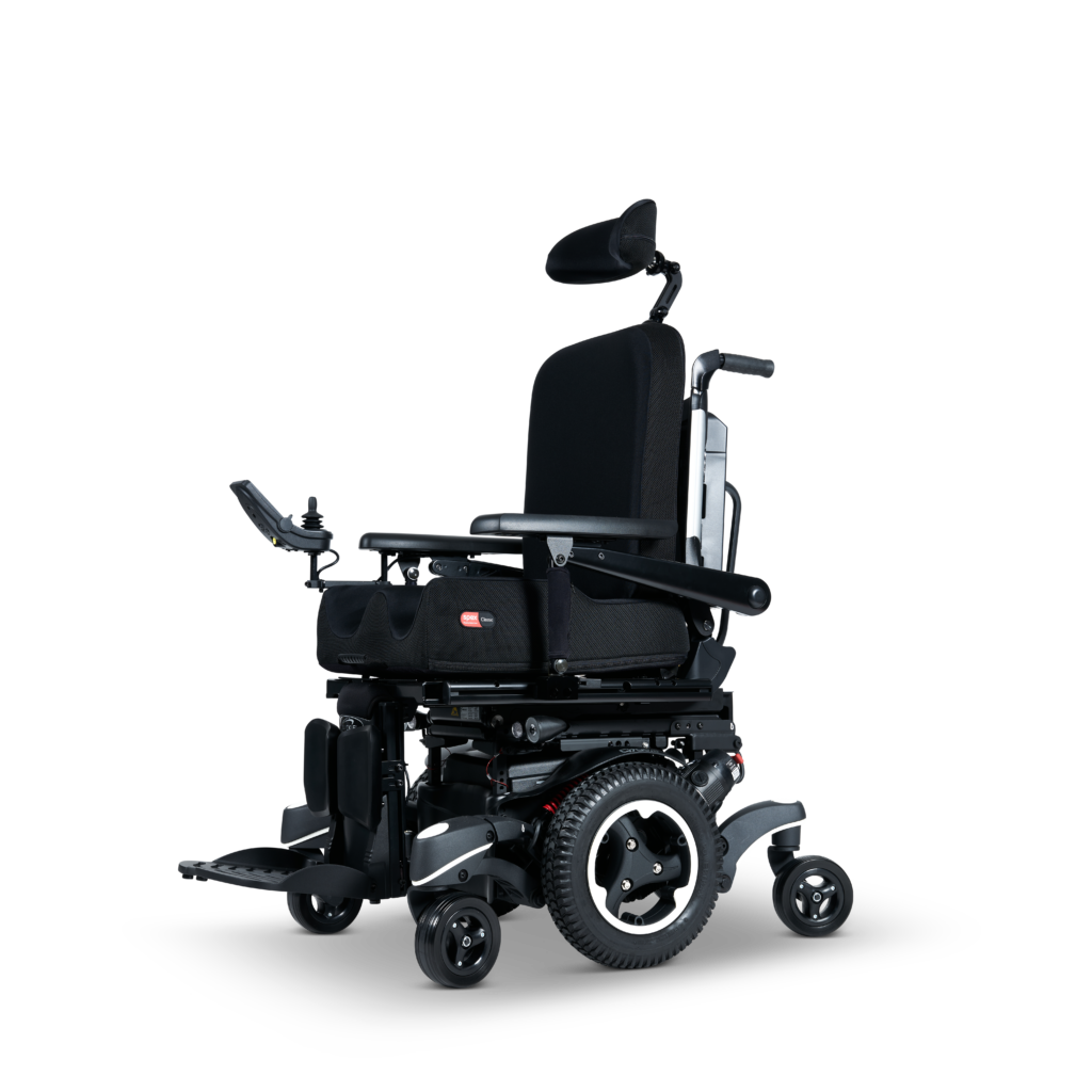 Front angle of the Quickie Q400 M powered wheelchair, showcasing its robust frame and advanced control system for dependable user mobility.