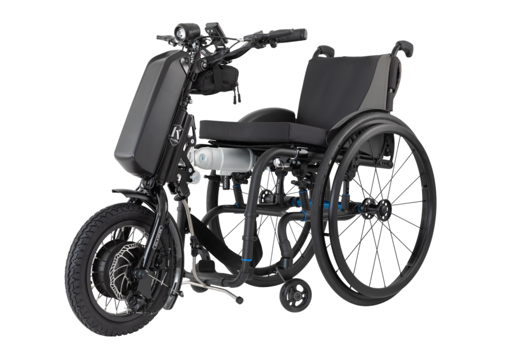 The Klaxon Klick Power boosts mobility with easy clip-on motor support, enhancing daily wheelchair travel.