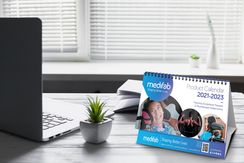 Medifab Desk Calendar 2021-2023 sitting on desk.