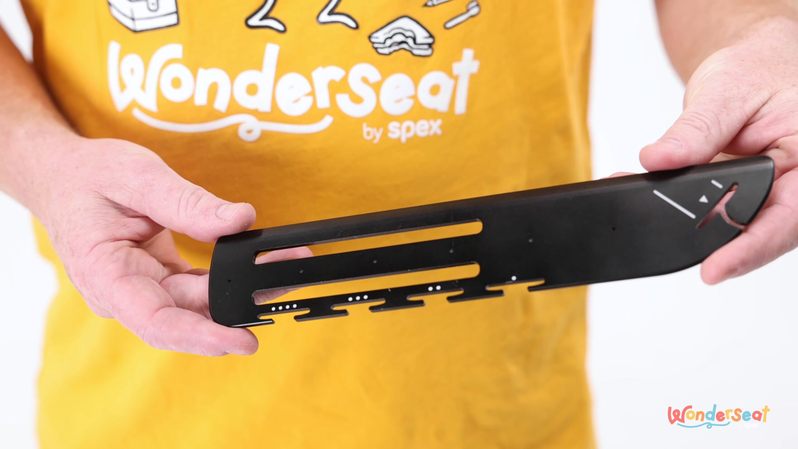 Person holding Wonderseat product showing its different features