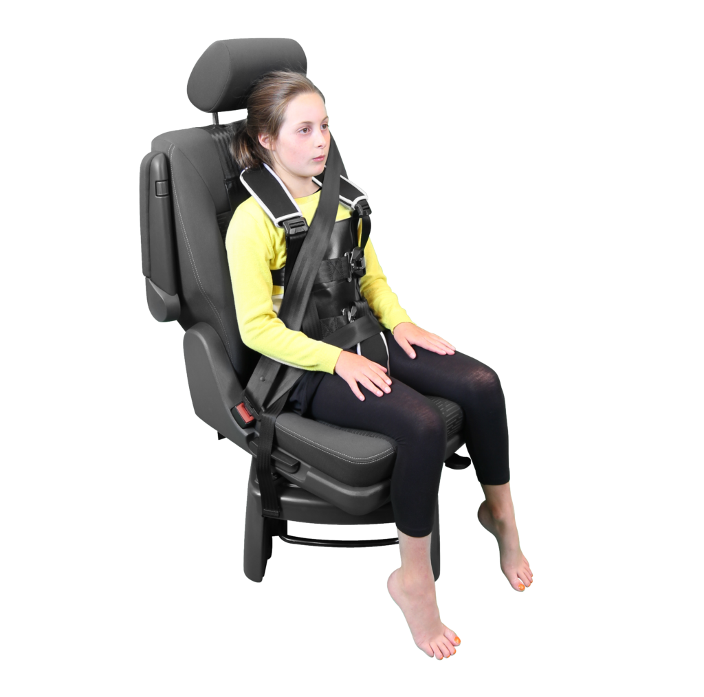 Houdini 31 harness being modeled by a young girl, providing secure postural support in vehicles.