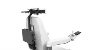 Rear view of a powered wheelchair featuring CoMoveIT -an advanced head control system mounted behind the headrest, with a control module on the armrest and a compact computing unit on the back. The system appears designed for individuals with limited hand mobility, enabling head-based driving or interaction.