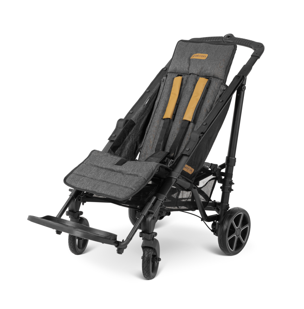 Patron Piper Comfort Stroller on a white background. Has grey upholstery, brown harness straps and the seat is low to the ground with foot supports and a high push handle that is above the head support.